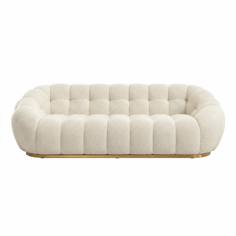 Kremowa sofa z tkaniny Boucle z drewnianą podstawą