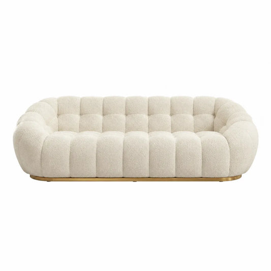 Kremowa sofa z tkaniny Boucle z drewnianą podstawą